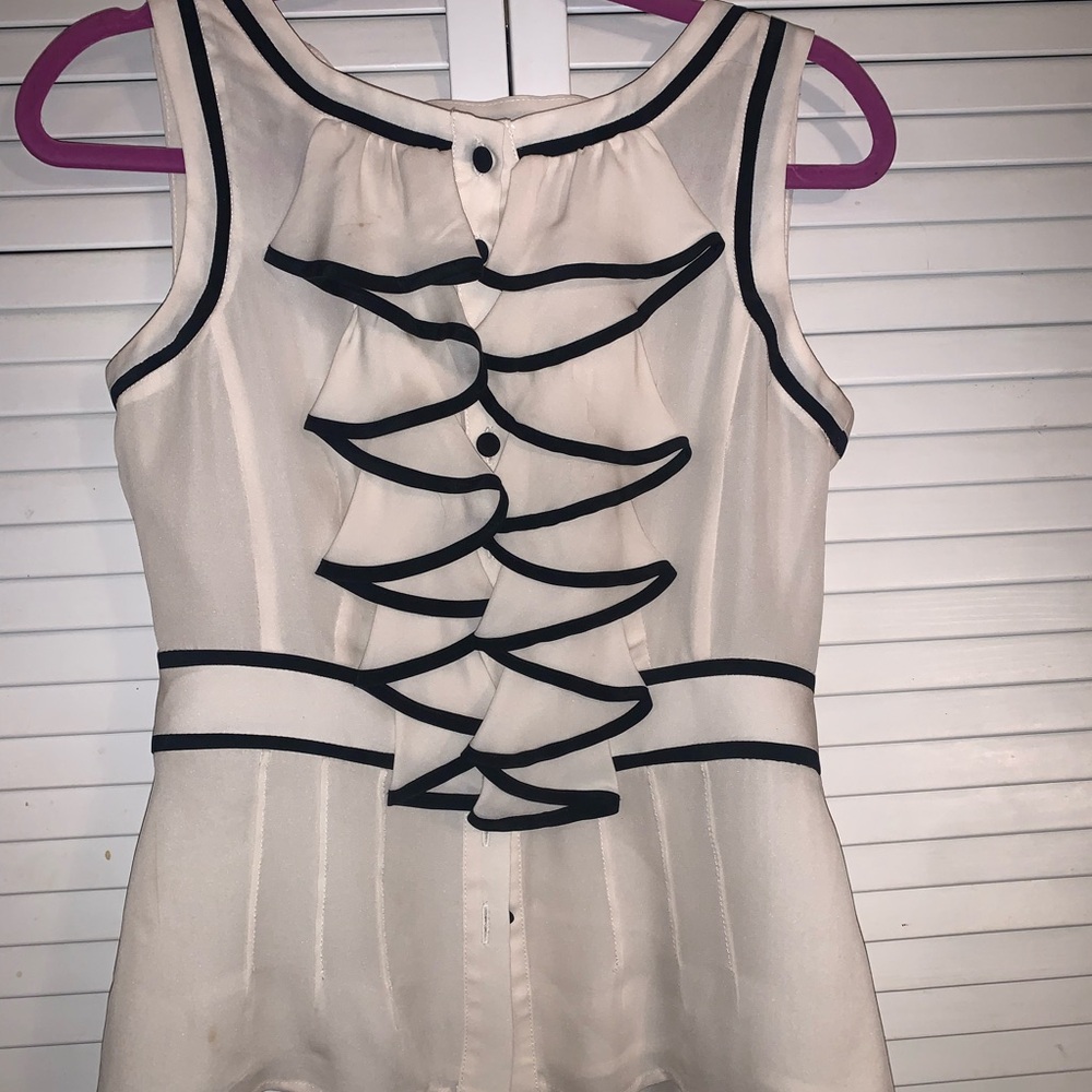 Elegant White Sleeveless Top with Black Trim